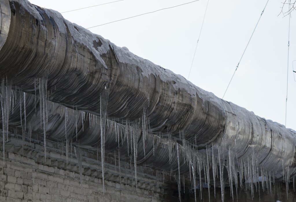 Large frozen pipe with icecycles