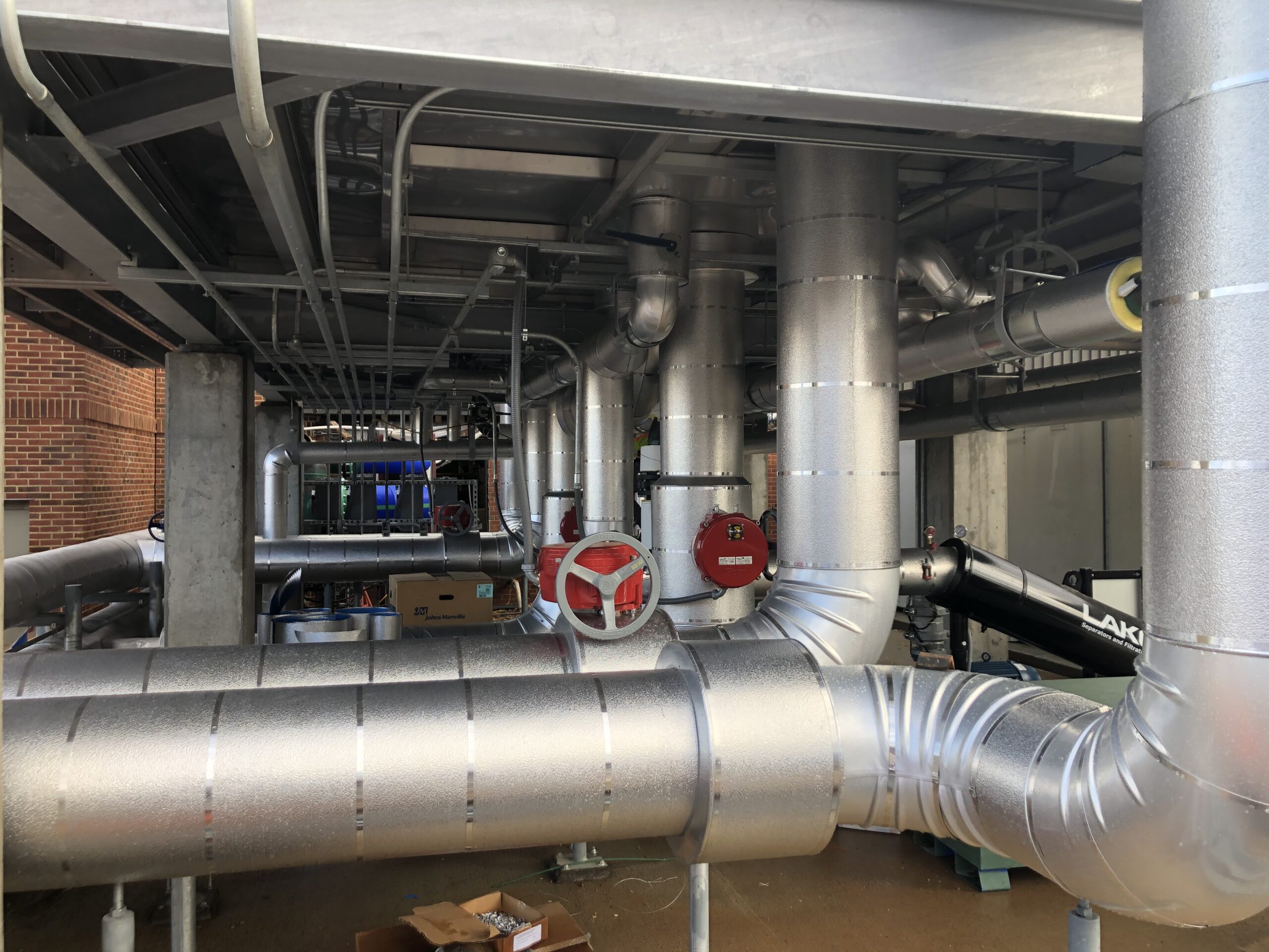 Industrial pipes wrapped in mechanical insulation