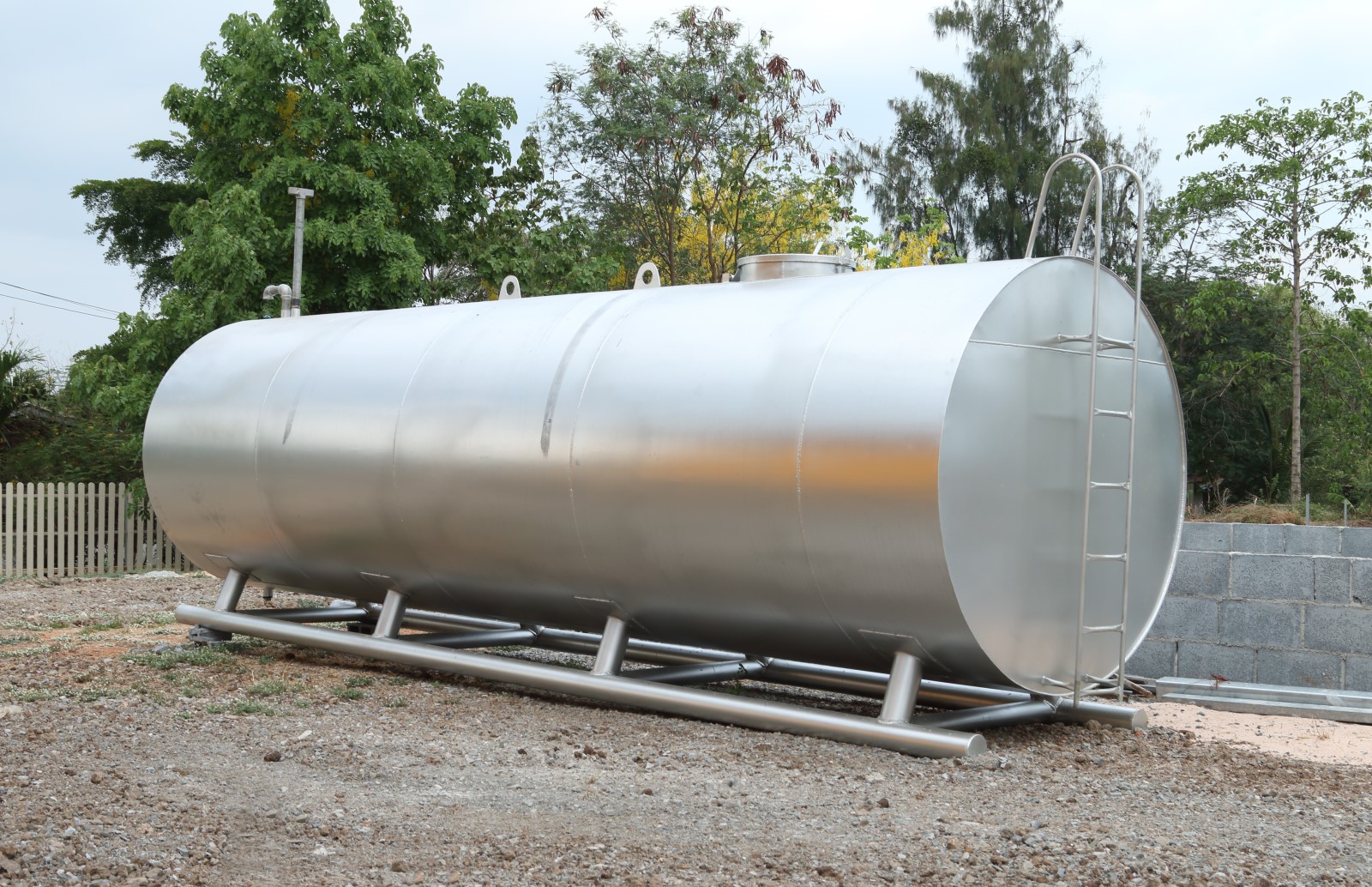 An external fuel storage tank with new protective insulation installed.