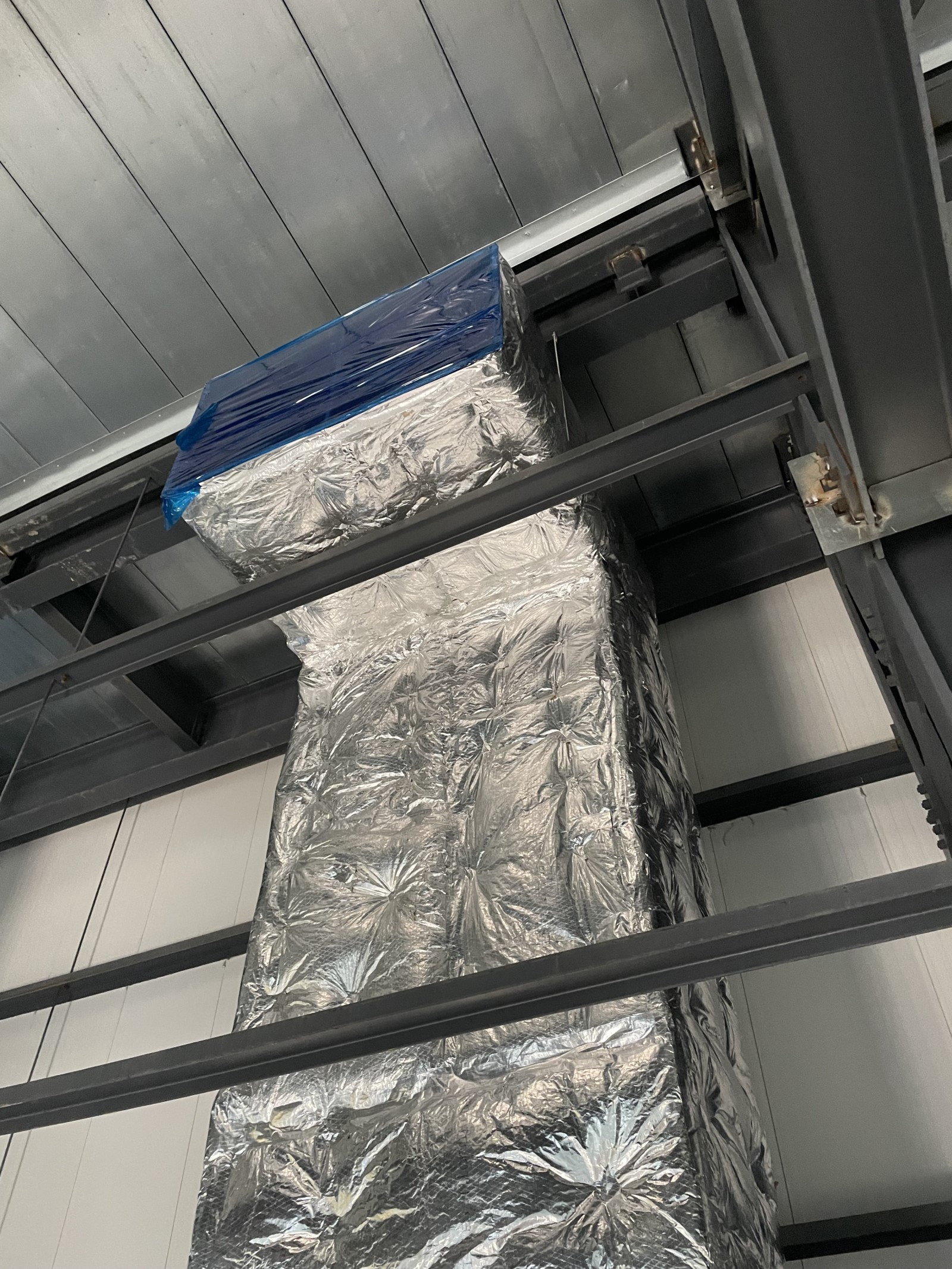 Industrial Insulation by MultiService Industrial is seen on 150-ft-tall ductwork